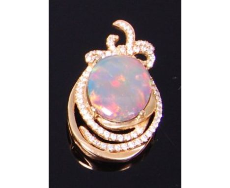 An 18ct gold, black opal and diamond set pendant, the four claw set cabochon opal weighing approx 4ct, within a brilliant cut