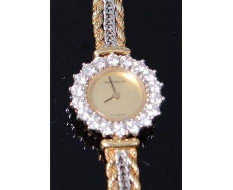 A Jaeger LeCoultre ladies 18ct gold diamond cocktail watch, the signed plain dial within a diamond set bezel, comprising 18 b