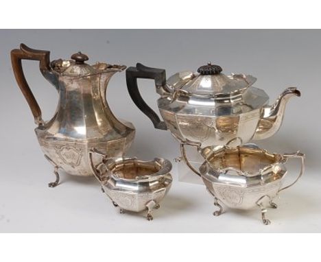 A George V silver four-piece tea and coffee set, comprising coffee pot and cover, teapot and cover, twin handled sugar and si