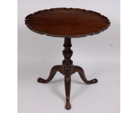 A 19th century mahogany occasional table, the circular tilt-top with piecrust edge and on a turned column, to acanthus carved