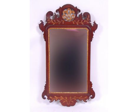 *A 19th century mahogany wall mirror, in the Chippendale style, having fret carved and parcel gilt pediment, h.97cm