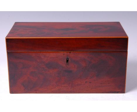 *A George III mahogany and boxwood strung tea caddy, of plain rectangular form, the hinged lid opening to reveal twin compart