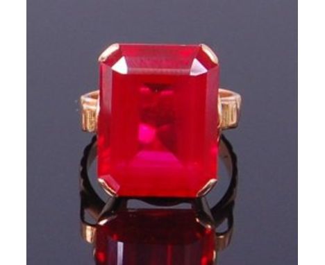 A contemporary Thai yellow metal and ruby set dress ring, the octagon cut ruby (heat treated) measuring approx 18 x 14 x 7.5m