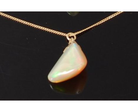 A polished opal pendant, weighing approx 11ct, on 14ct gold finelink neck chain, pendent h.2cm