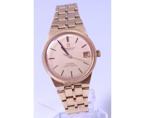 A gents Omega Constellation 18ct gold cased chronograph, the champagne dial having baton markers, date aperture, and signed O
