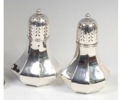 A near-pair of Edwardian silver sugar sifters, one stamped Tiffany & Co, each of octagonal faceted bulbous lower form, with r
