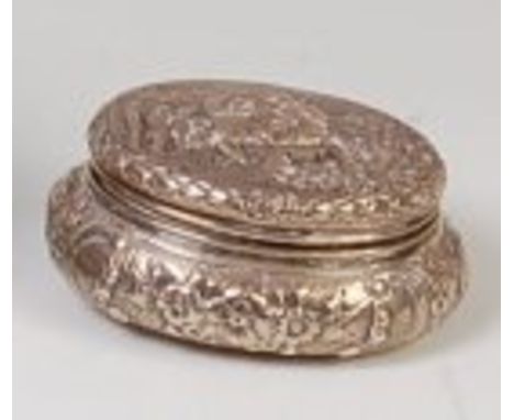 A 19th century Dutch silver table snuff-box, of domed oval form, the hinged cover emboss decorated with mediæval battle scene