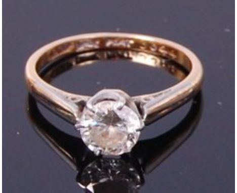 An 18ct gold and platinum diamond solitaire ring, the claw set old cut diamond weighing approx 0.8ct, we would assess colour 