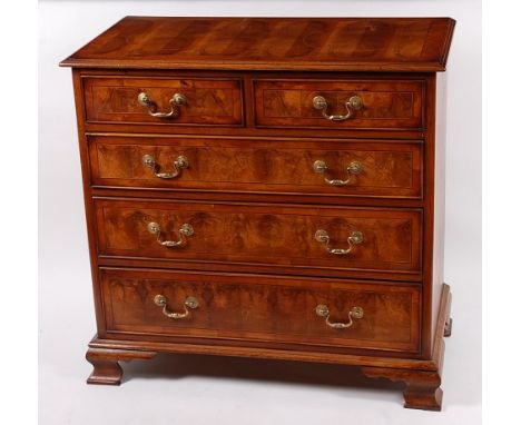 A William & Mary style oyster veneered and crossbanded squarefront chest, of two short over three long graduated drawers, wit