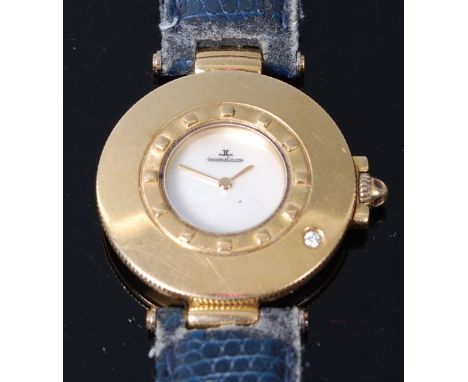 A Jaeger LeCoultre ladies 18ct gold cased wristwatch, having a signed mother of pearl dial and single diamond set wide bezel,