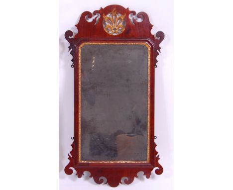 *A 19th century mahogany and parcel gilt fret carved wall mirror, in the Chippendale style, 94 x 51cm