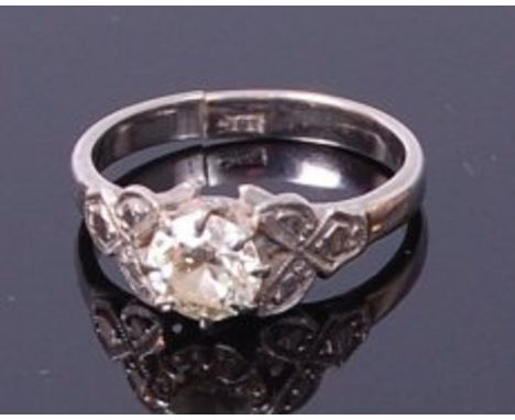 An 18ct white gold diamond solitaire ring, the claw set old cut diamond weighing approx 0.85ct, we would assess colour as J/K