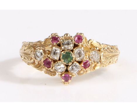 Emerald, diamond and ruby Giardinetto ring, having an emerald and diamond flowerhead surrounded by five rubies and a further 