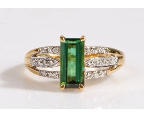 A 18 carat gold santa rosa tourmaline and diamond ring, the head set with a claw mounted baguette cut santa rosa tourmaline s