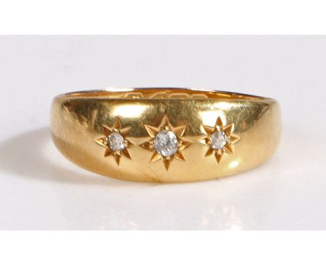 An 18 carat gold and diamond gypsy ring, the head set with three diamonds, weight 2.6 grams, rig size O