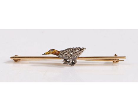 A yellow metal bar brooch decorated with a bird, the body of the bird decorated with diamonds and a enamel head, weight 2.9 g