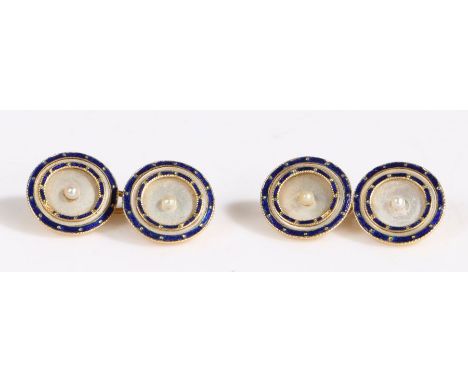 A pair of 18 carat gold and mother-of-pearl cufflinks, the round mother of pearl plaques each feature two concentric blue ena