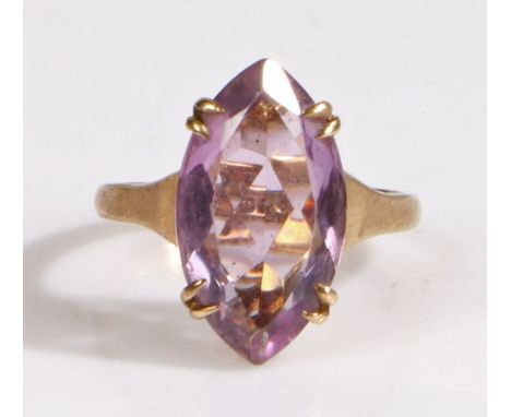 A 9 carat gold and amethyst ring, the head set with a claw mounted navette cut amethyst, ring size O weight 3.9 grams&nbsp;