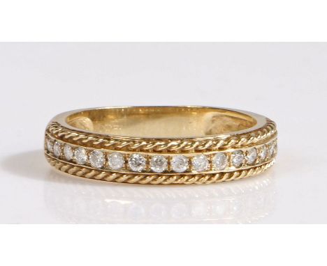 9 carat gold and diamond half-hoop eternity ring, having an elegant line of&nbsp; diamonds set within rope detailing. Ring si