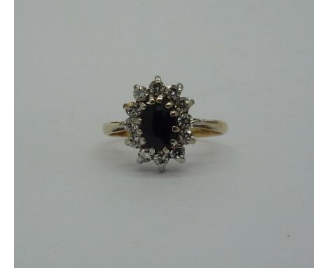 A yellow metal and cubic zirconia ring, weight 1.4g, size H