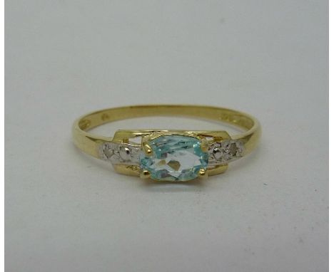 A 9ct gold, blue topaz and diamond ring, weight 1g, size O