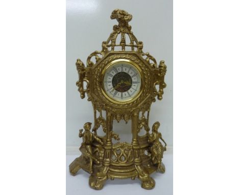 A cast metal mantel clock, height 37cm