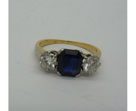 An 18ct gold, platinum set diamond and sapphire ring, each diamond approximately 0.25 carat diamond weight, size J