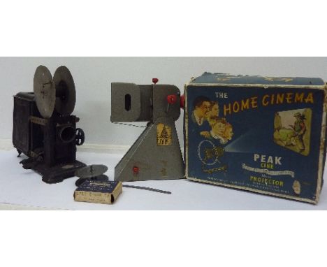 A Peak Cine 16mm projector, boxed and an AK German lantern, a/f