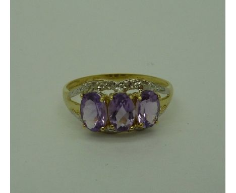 A 9ct gold, amethyst and diamond ring, weight 1.4g, size O