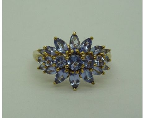 A silver gilt and tanzanite cluster ring, size U