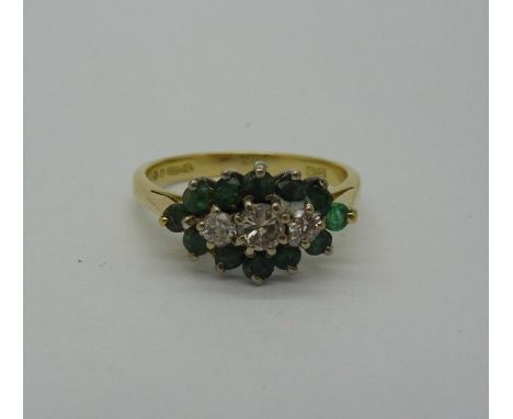 An 18ct gold cluster ring, weight 3.2g, size M