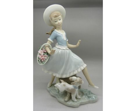 A Lladro figure, girl with dog, E-15N backstamp, height 26cm