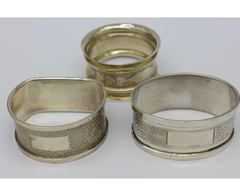 An oval silver napkin ring and two other silver napkin rings, weight 36g