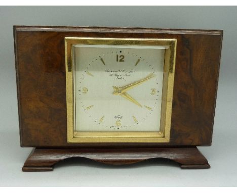 A walnut cased Elliott mantel clock, retailed by Garrard & Co., height 14.5cm, top with presentation plaque dated 1971