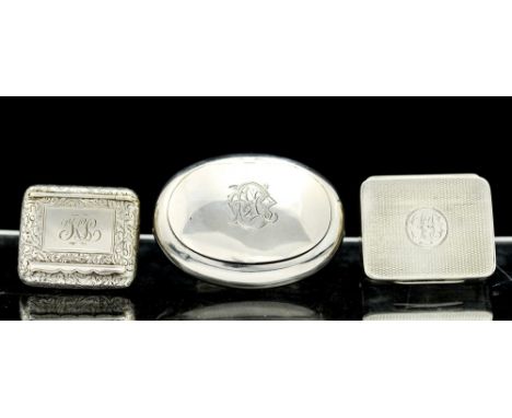 Three various Edwardian silver boxes including: a shaped oval box, the hinged cover engraved with a monogram, Deakin & Franci