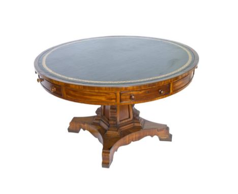 An early Victorian mahogany drum top pedestal library table, on a chamfered square section tapered support and ogee bracket f