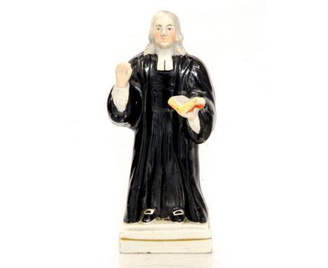 A Staffordshire Prattware figure of John Wesley, on square base, 15cm highcondition: chips to back