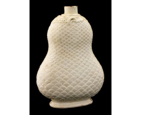 A Staffordshire creamware  flask, circa 1750, double gourd form with fishs scale relief moulding and Rococo scroll neck, 13cm