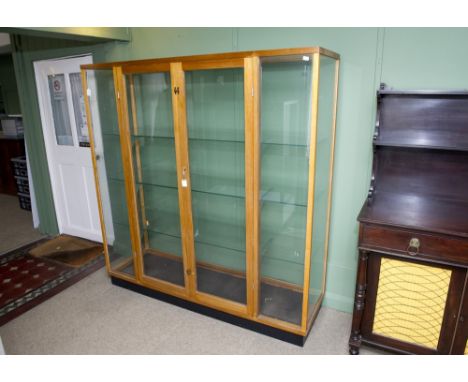 Mahogany three shelf glazed display cabinet, double doors flanked by glazed panels and sides