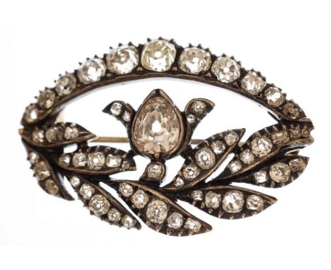 A Victorian diamond brooch, the garland style brooch comprising a central pear shaped old cut diamond approximately 0.90 cara
