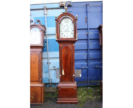 A George III mahogany eight day longcase clock, the dial inscribed 'J Blaylock, Carlisle', the arched hood with three ball fi