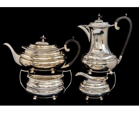 A George VI silver four-piece tea and coffee service, plain oblong in the Georgian manner, each piece with gadroon border on 