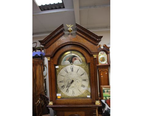 A George III oak 30 hour longcase clock, the dial inscribed 'Blaylock, Longtown', the hood having a broken pediment with eagl