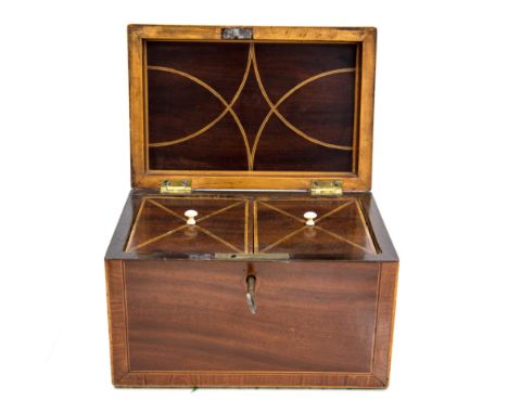 A George III mahogany, crossbanded and boxwood strung tea caddy, circa 1810, of rectangular form, strung interior with twin l