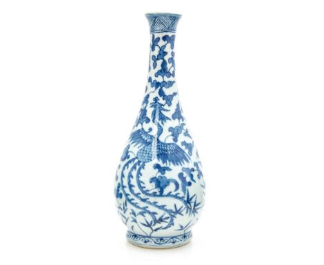 A Chinese blue and white Wanli vase, elongated baluster form, decorated with phoenix birds within foliate ground, six charact