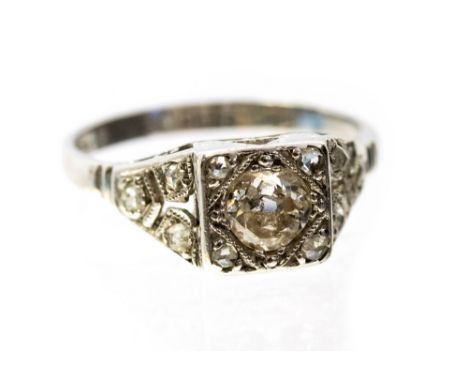 An Art Deco diamond and platinum ring, set centrally with an old cut diamond approx .33 ct with square setting set with four 