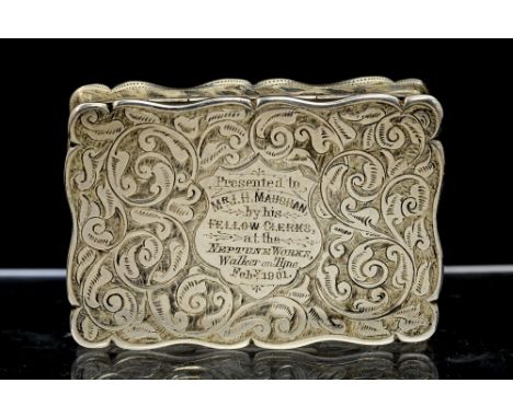 A Victorian silver snuff box, cartouche shaped the hinged cover and body profusely engraved with scrolling foliage, plain und