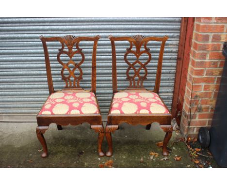 A pair of George III oak side chairs, circa 1760, in the manner of Thomas Chippendale, shell carved crest rails, shaped and p
