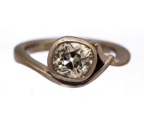 A diamond solitaire 18ct white gold crossover ring, the cushion shaped old cut diamond weighing approximately 1.50 carats, as