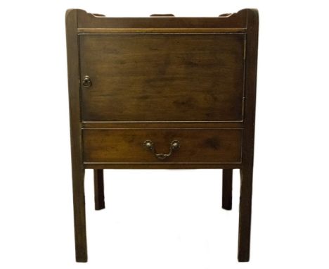 A George III mahogany commode, circa 1780, gallery top with handles, cupboard below, single frieze drawer, chamfered block le